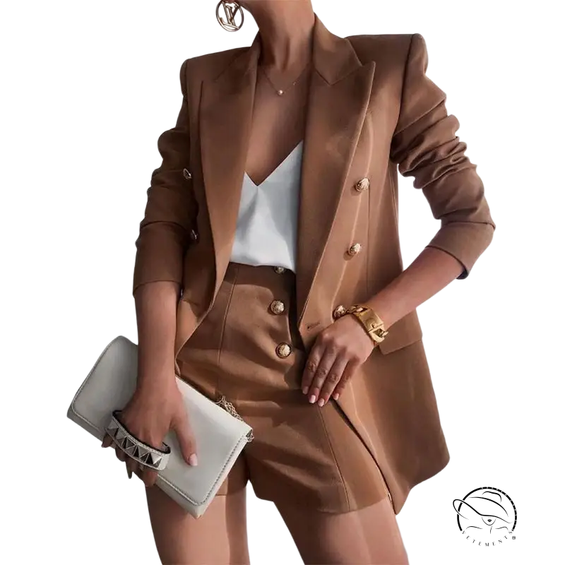 High end jacket with brown tailored suit, white camisole, and clutch