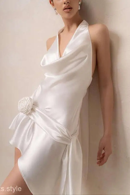 Elegant white French high grade halter dress with draped design and floral waist accent