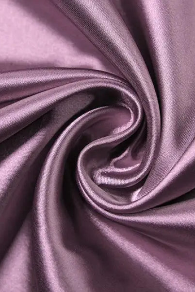 Swirled purple satin fabric with smooth, shiny texture on high grade halter dress