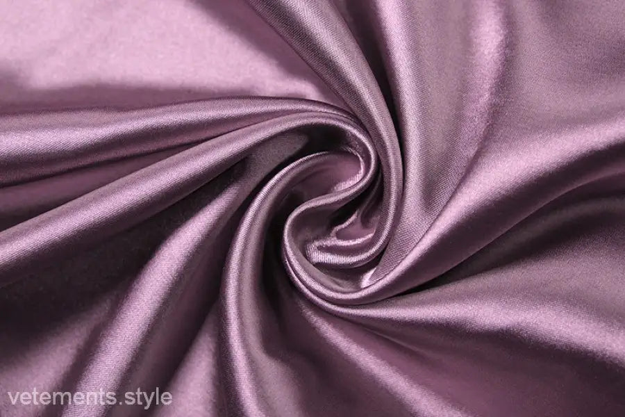 Swirled purple satin fabric with smooth, shiny texture on high grade halter dress