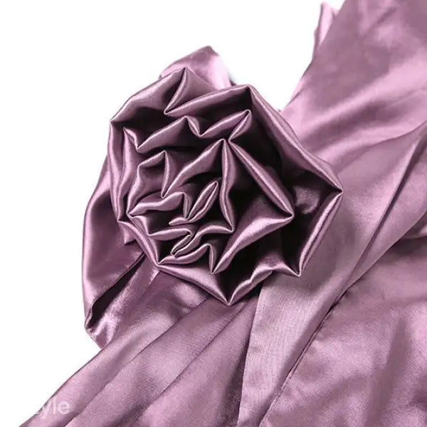 Shimmering purple silk fabric with intricate folds on a high grade halter dress