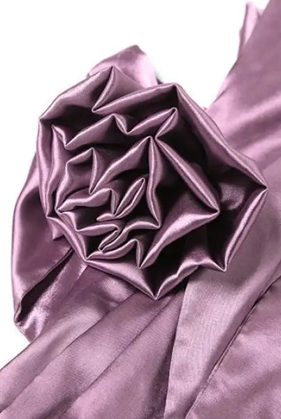 Shimmering purple silk fabric with intricate folds on a high grade halter dress