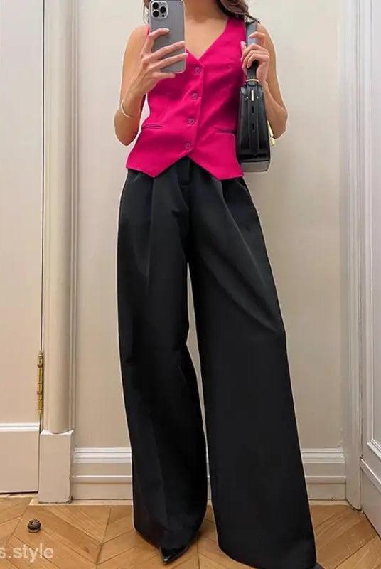 Hot pink sleeveless vest with black wide-leg palazzo pants in a high grade loose suit
