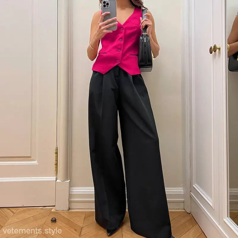 Hot pink sleeveless vest with black wide-leg palazzo pants in a high grade loose suit