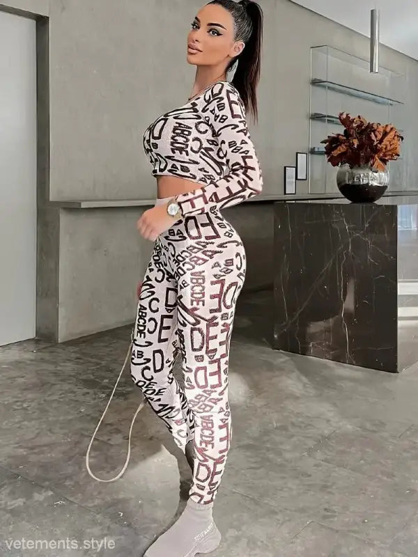 Woman in patterned athletic wear showcasing High Waist Hip Lift Leggings for elegance