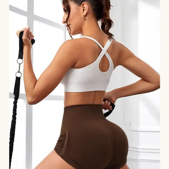 Woman in athletic wear demonstrating High Waist Peach Hip Fitness Pants during exercise