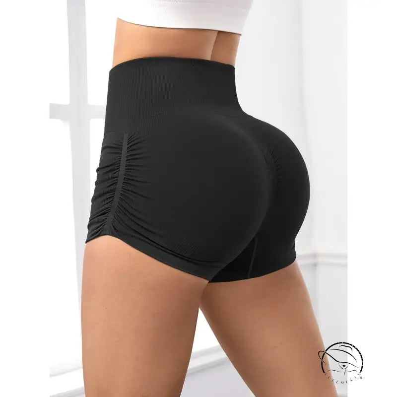 Black high-waisted peach hip fitness pants with ruched sporty design