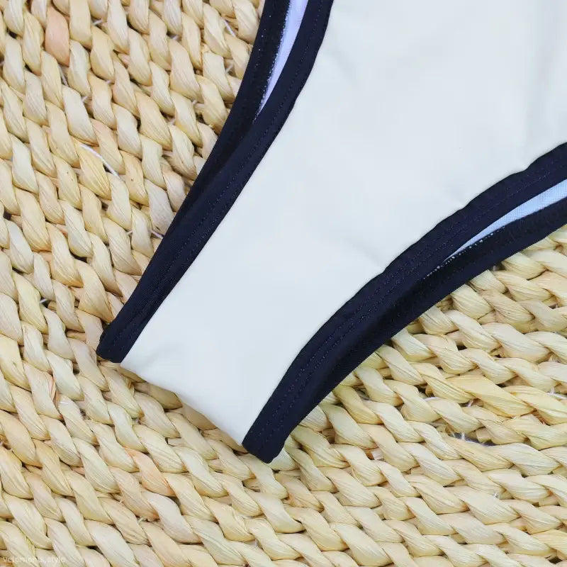 High Waist Bikini with white fabric and black trim edges for stylish summer swimwear