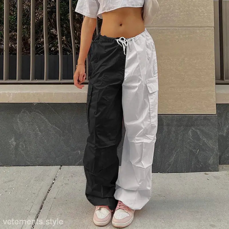 White loose pants with a high waist wide leg design, black and white color block pattern