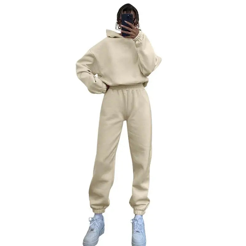 Cream-colored winter hooded casual long sleeve sweater with matching joggers and white sneakers
