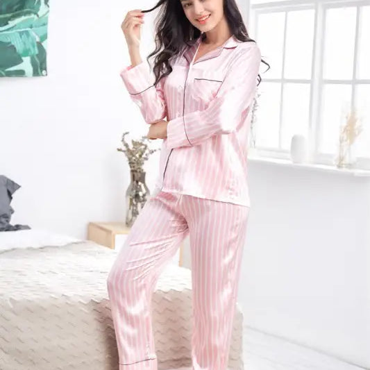 Pink striped satin pajama set with long sleeves and pants, ideal silk striped homewear