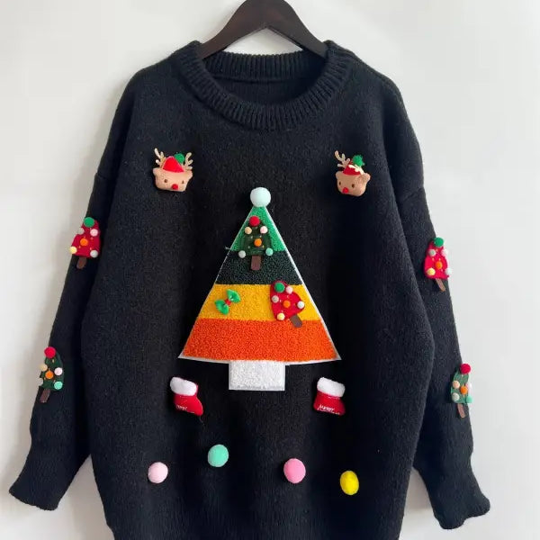 Black Christmas sweater with colorful festive decorations and appliques, featuring a Christmas tree jacquard design and three dimensional decoration details