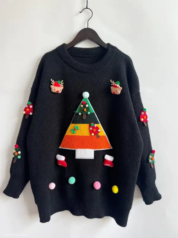 Black Christmas sweater with colorful festive decorations and appliques, featuring a Christmas tree jacquard design and three dimensional decoration details