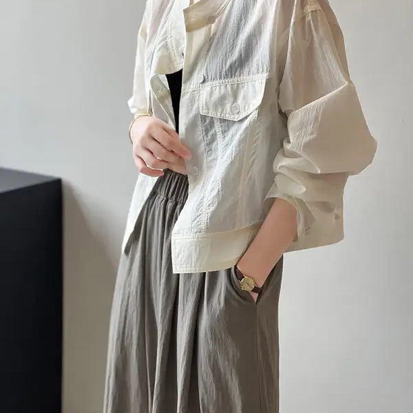 Khaki Green Casual Polyester Shirt showcasing a woman’s light-colored, short summer cardigan with pockets, available with free shipping