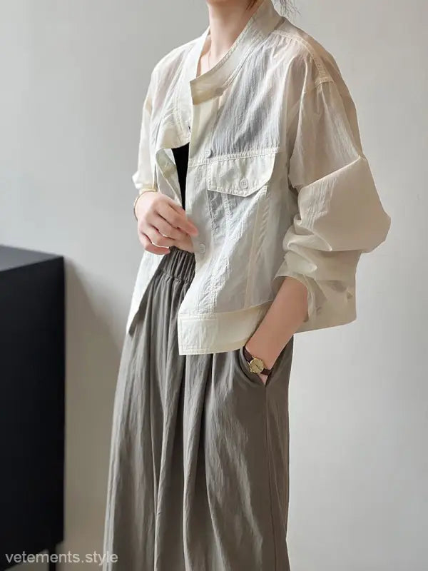 Khaki Green Casual Polyester Shirt showcasing a woman’s light-colored, short summer cardigan with pockets, available with free shipping