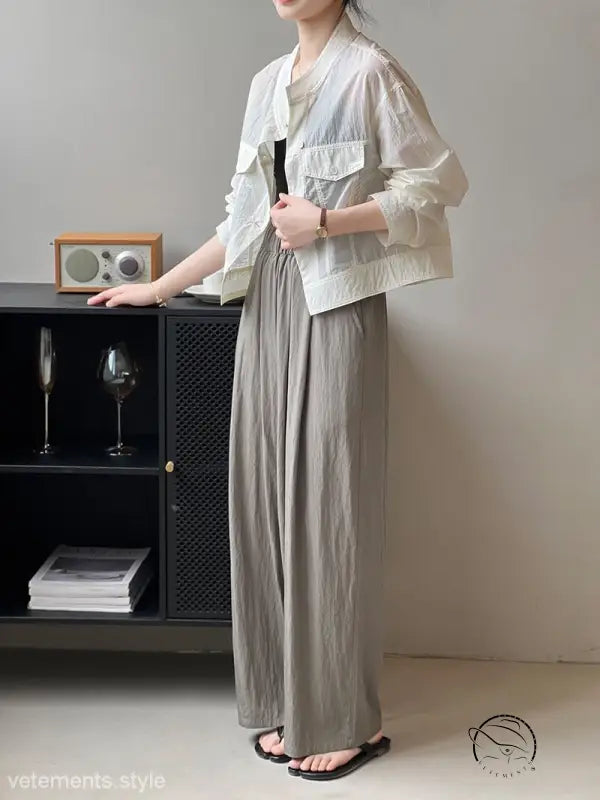 Woman in khaki green summer cardigan short with wide-legged pants
