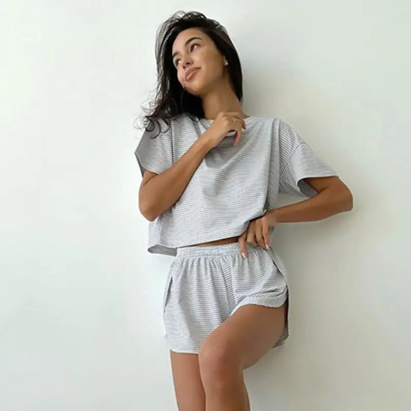 Woman modeling knitted loose pajamas summer stripe split sleeve lounge set in light grey and white
