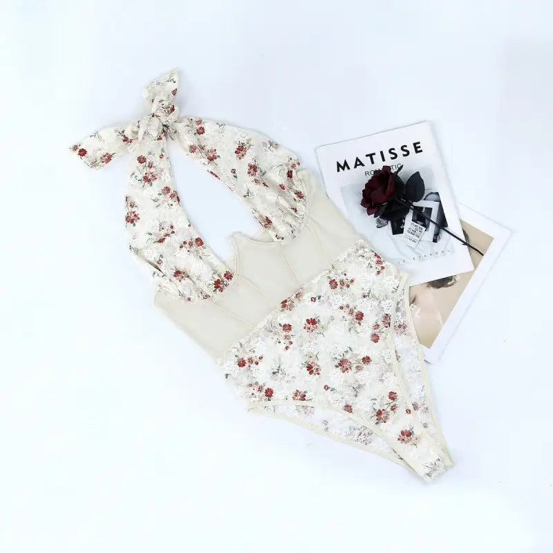 White floral lace teddy bodysuit with tie-shoulder straps, ideal as a queen stitching corset