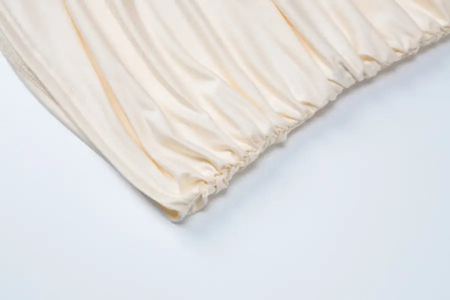 Wrinkled elasticized cream-colored fabric for lace vest pleated skirt set in stylish summer look