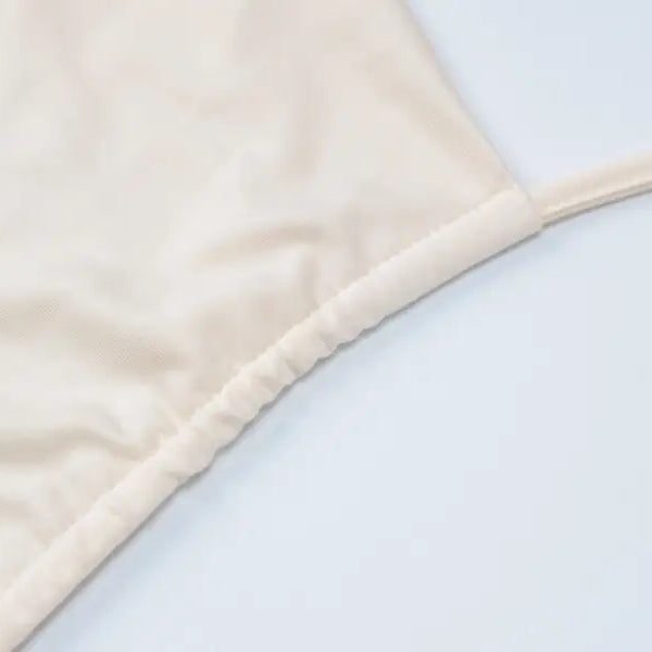 Beige fabric garment from Lace Vest Pleated Skirt Set for a Stylish Summer Look