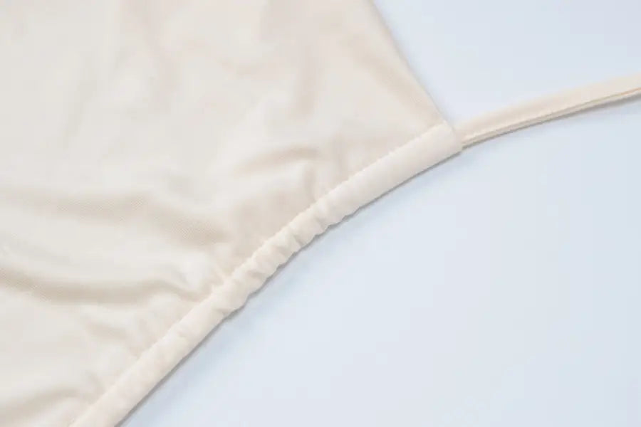 Beige fabric garment from Lace Vest Pleated Skirt Set for a Stylish Summer Look