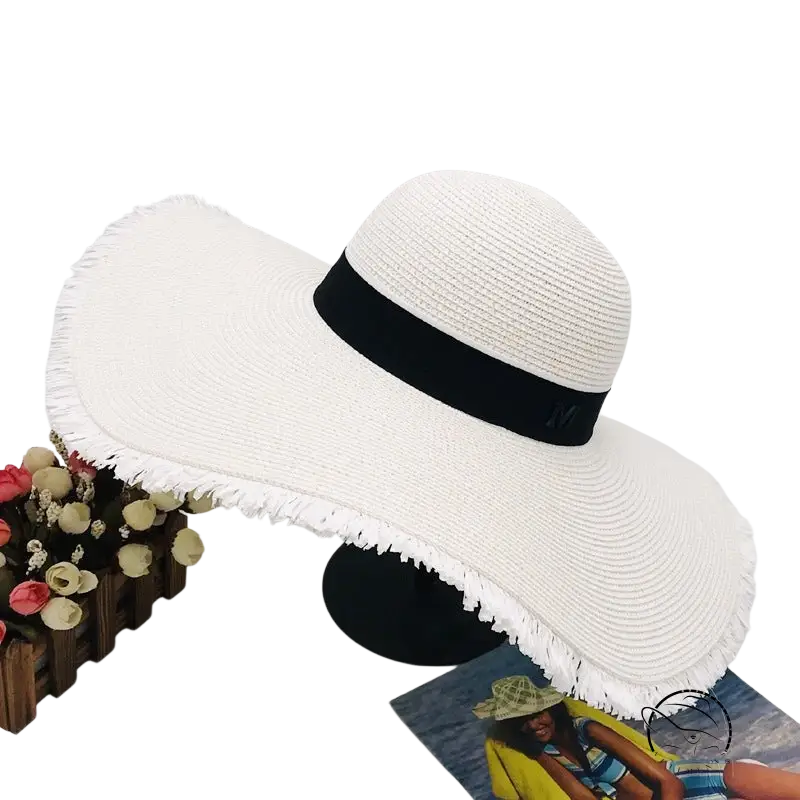 Lack of Color wide-brim sun hat with white straw and black ribbon band