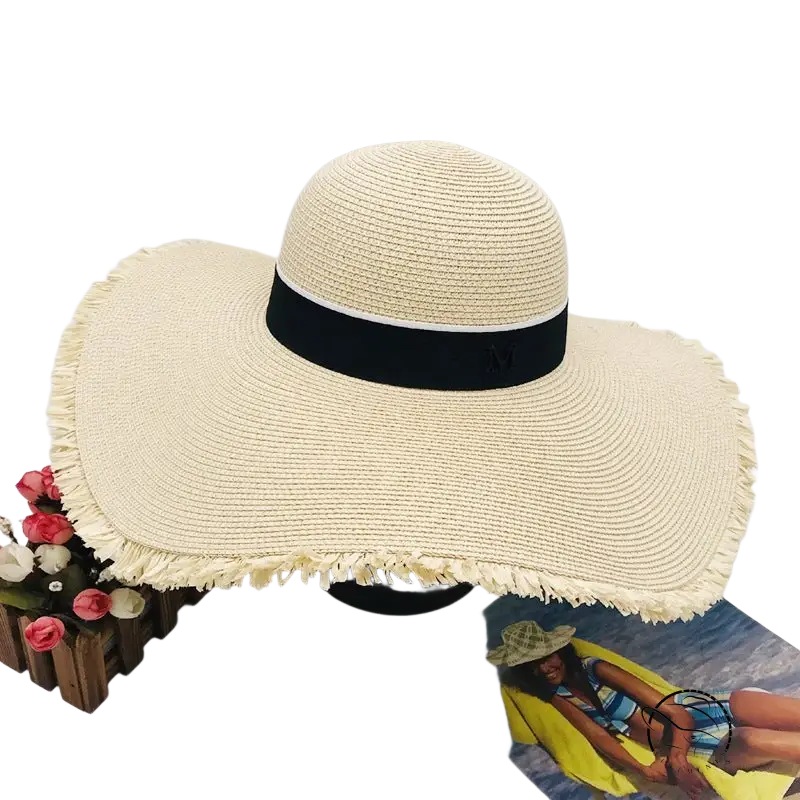 Lack of Color wide-brim sun hat with beige straw, black ribbon band, frayed braid broad brim
