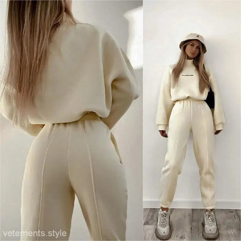 Cream-colored Lanna Alphabet Outfit featuring casual embroidered mock neck sweatshirt