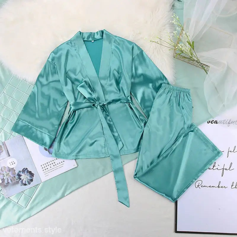 Teal silk pajama set with wrap top and matching pants, part of casual satin pajamas collection