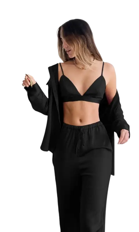 Woman in light brown three piece pajamas with collared shirt