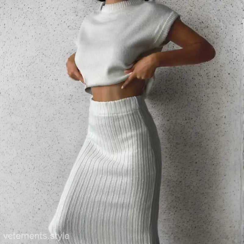 Light coffee cozy knitted set featuring a sleeveless top and midi skirt for a stylish look