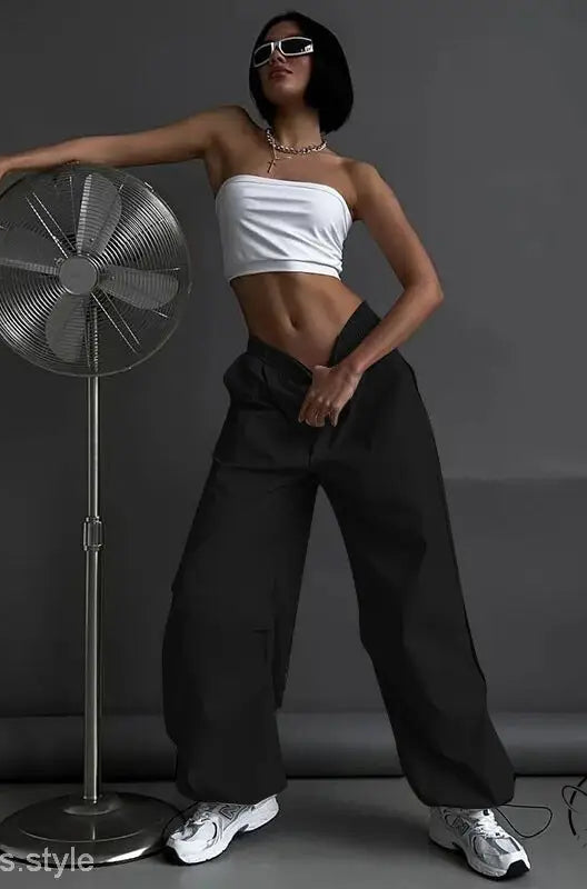 Woman in light gray casual cute trousers and white tube top