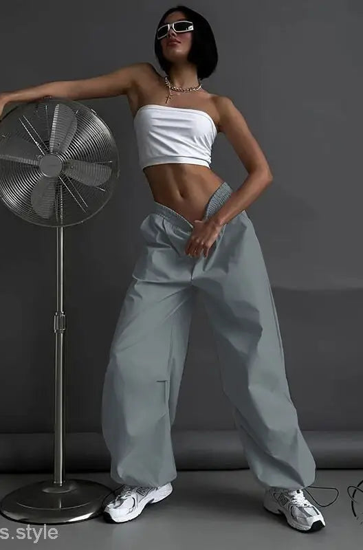 Woman in white tube top and light gray casual cute trousers