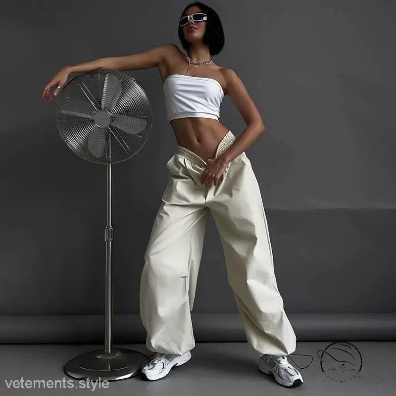 Woman in white tube top and light gray casual cute trousers