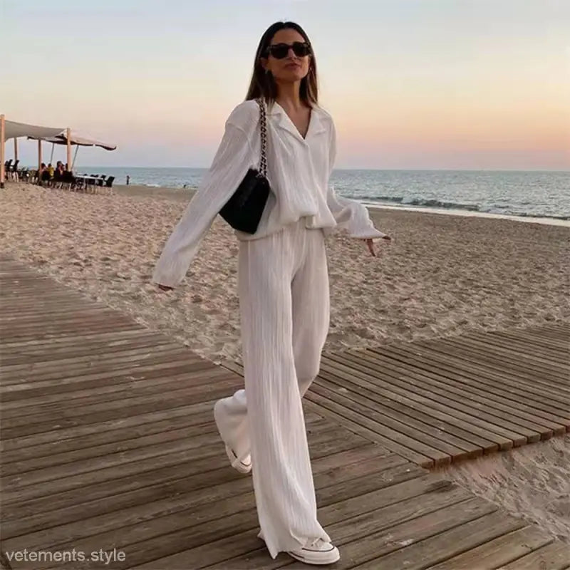Woman in white pantsuit modeling Beautiful Loose Casual Polyester Long Sleeve Top set with watermelon red texture