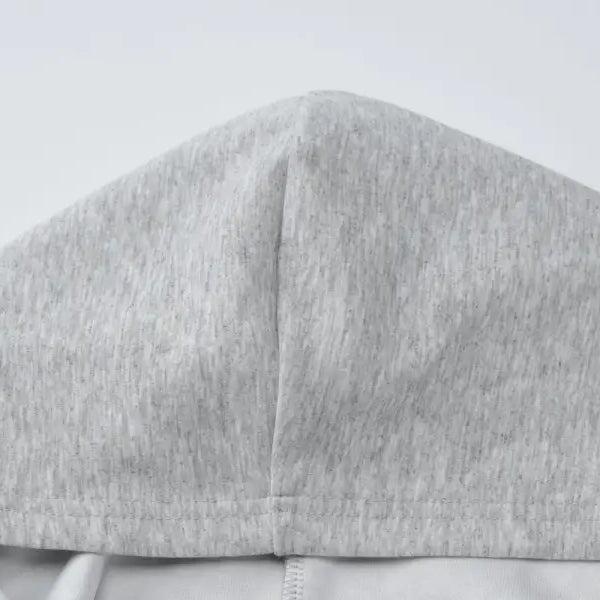 Gray fabric hood or cap with a seam down the center.