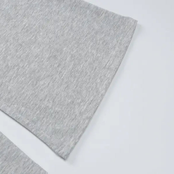 Gray textured sheet or fabric with a slightly mottled surface.