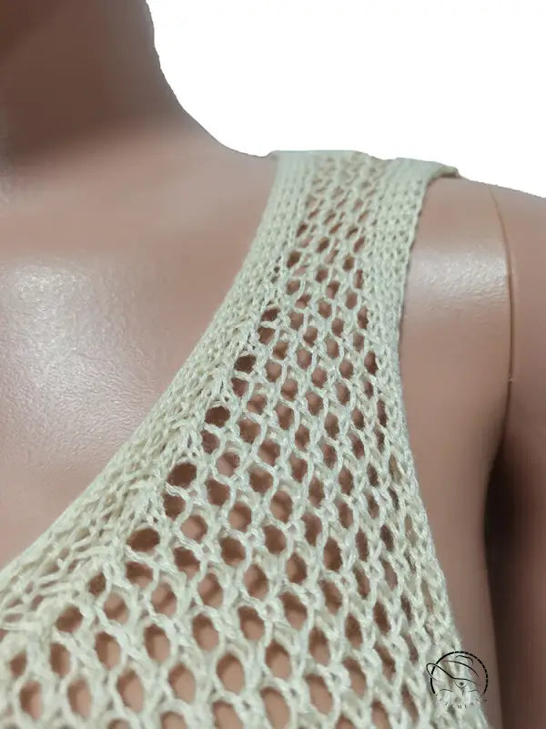 Light green crocheted tank top in knitted beach dress with fringe