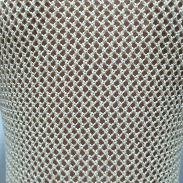 Beige crocheted fishnet garment from Knitted Beach Dress with Elegant Fringe Detail