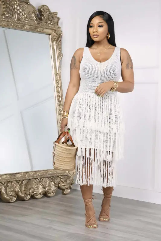 White fringed knitted beach dress with elegant fringe detail for stylish summer wear