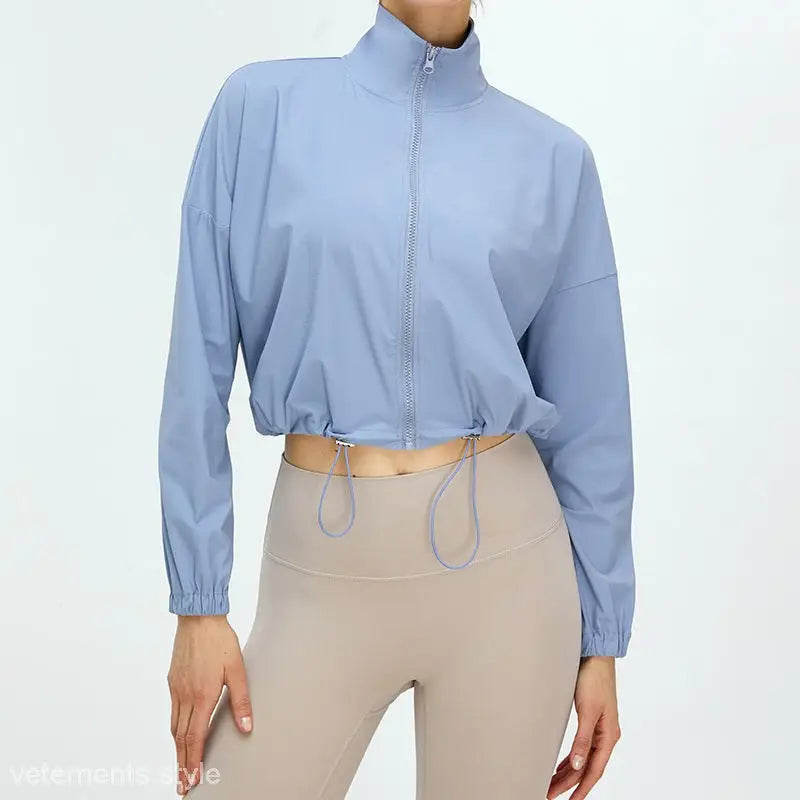 Light Khaki and Cloudy Blue Running Fitness Clothes featuring a light blue cropped zip-up jacket