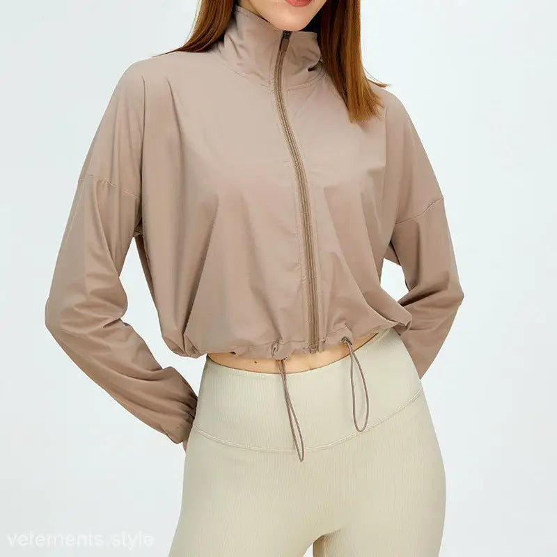 Beige cropped zip-up jacket with drawstring hem and stand-up collar for running fitness clothes