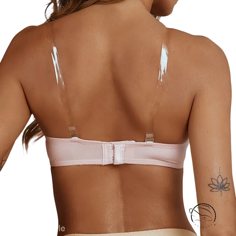 Light pink wireless bra with removable shoulder straps on woman’s back