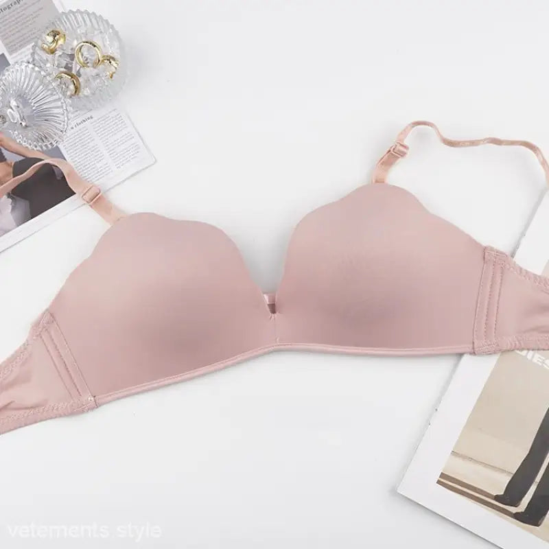 Light pink wireless bra with adjustable shoulder straps and removable bra shoulder strap