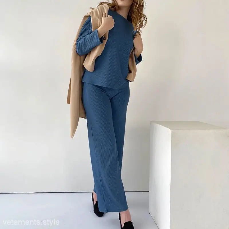 Blue knit sweater and wide-leg pants ensemble with beige overcoat, perfect as loose comfortable pajamas two piece for spring and fall