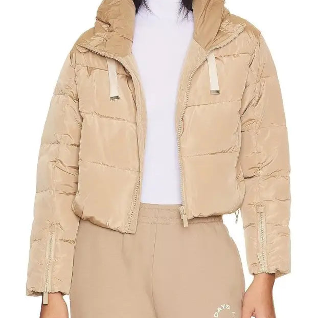 Beige puffer jacket showcasing a loose short cotton jacket with pocket and zipper