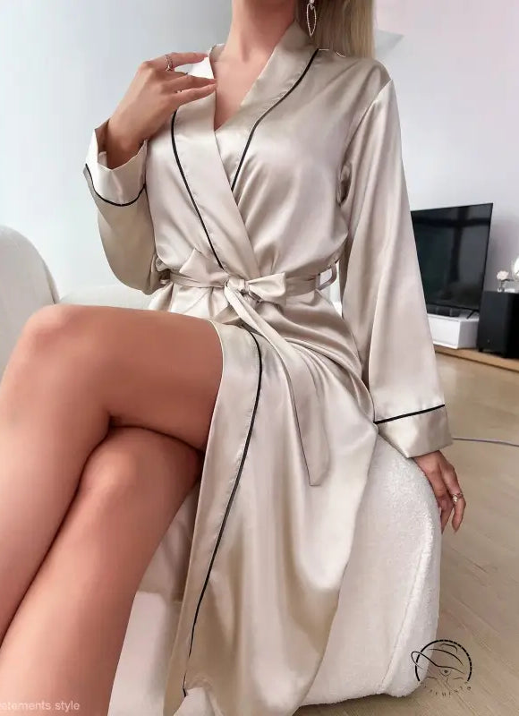 Champagne satin robe with black piping and tied waist, ideal as a sexy cardigan bathrobe