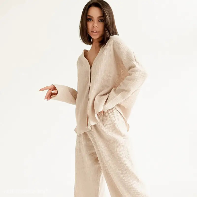 Woman in beige long sleeve pajamas from Lounge Sets; ideal for summer double layer wear