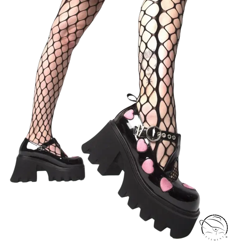 Black patent leather platform Mary Jane heels with pink hearts and silver buckle
