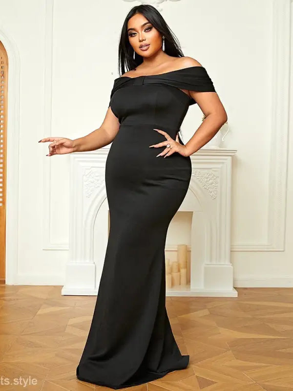 Luxury evening dress for women featuring an off-the-shoulder black gown, sold now